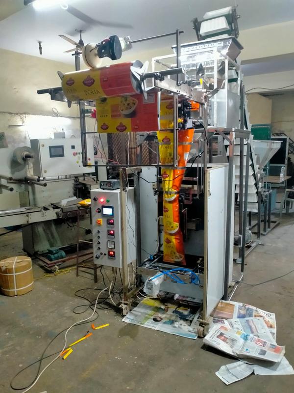Automatic Multihead Packaging Machine is an advanced packaging system designed for fast, accurate, and efficient weighing and packing of food and non-food products. Equipped with a high-performance multihead weigher, this machine delivers precise weight combinations to minimize product giveaway and maximize production efficiency. It is widely used for packing snacks, namkeen, chips, dry fruits, candies, frozen foods, pulses, hardware items, and other granular or irregular-shaped products.Manufactured with robust stainless-steel construction and smart automation technology, the machine ensures hygienic operation, stable performance, and long-lasting durability. Its intelligent control system allows easy adjustment of packaging speed, pouch size, and weight settings, making it suitable for different production requirements.The Automatic Multihead Packaging Machine supports various pouch styles including pillow pouches, center seal pouches, gusset pouches, and zipper bags. With high-speed operation, accurate weighing, and reduced manual labor, it helps industries improve packaging quality while increasing overall productivity.Designed for continuous industrial use, this machine is energy-efficient, low maintenance, and capable of handling high-volume packaging operations with excellent sealing quality and consistency.Key FeaturesAdvanced multihead weighing technologyHigh-speed automatic packaging systemAccurate and consistent weight controlStainless steel hygienic body structureUser-friendly touchscreen interfaceSupports multiple pouch formatsLow product wastage and energy-efficient operationReliable sealing and durable performanceApplicationsIdeal for packaging:Namkeen and snacksPotato chipsDry fruits and nutsFrozen food productsPulses and grainsCandies and confectioneryTea and coffee granulesHardware and small industrial parts