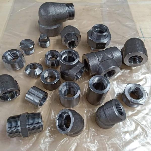 Here is a structured list of the threaded and socket-weld fittings shown in your catalog image:## Available Fitting Types* 90 ELBOW: Changes piping direction by 90 degrees.* Coupling: Connects two lengths of pipe together.* Cross: Four-way fitting connecting multiple lines.* Hex.Bushing: Reduces a female thread to a smaller size.* Hex.Plug: Plugs a female-threaded opening.* Hose nipple: Connects a pipe thread to a flexible hose.* Red.Hex.Nipple: Connects two female threads of different sizes.* Red.Socket banded: Reinforced female connection for different pipe sizes.* Socket banded: Reinforced female-threaded straight pipe connection.* Square Plug: Plugs a female opening using a square-head drive.* Street.Elbow: 90-degree elbow with male threads on one end, female on the other.* Tee: T-shaped fitting to split or combine flow.* Union MF: Male-to-female disconnect fitting for easy disassembly.* WELD NIPPLE: Pipe piece with one threaded end and one weld end.* Barrel Nipple: Short length of pipe with male threads on both ends.* Hex.Nut: Threaded fastener used to secure joints or fittings.------------------------------Would you like me to look up the standard material grades (like Stainless Steel 304/316), the pressure ratings (typically 150# or 3000#), or the dimensional standards (such as ASME B16.11) for these specific items?