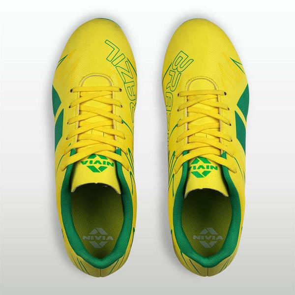 Firm ground demands speed, control, and confidence in every step. The NIVIA WC Football Studs are engineered for players who attack space accelerate with intent and stay balanced through high-intensity play. The 3D embossed TPU upper provides a structured water-resistant fit that enhances touch and keeps your foot secure during rapid movements. Underfoot the Duofoam midsole delivers responsive cushioning helping you stay light and reduce impact through sprints tackles and strikes. The nylon mid shank adds midfoot stability allowing smoother transitions and efficient energy transfer. Built with a TPU studded outsole the shoe delivers strong traction and grip on natural grass surfaces giving you the confidence to pivot accelerate and control the game. Designed with IndiFoot shaping it offers a natural fit with better toe protection for Indian players. Built for speed. Designed for control. Made for the ground you play on.Natural IndiFoot Fit: U-shaped design improves comfort and toe protection. Structured Control Upper: 3D embossed TPU enhances durability and ball touch. Midfoot Stability Support: Nylon mid shank improves balance and movement control. Firm Ground Grip System: TPU stud outsole provides traction and stability on grass.Responsive Cushion Feel: Duofoam midsole delivers energy return and impact comfort.