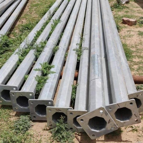 Hexagonal Pole is manufactured using premium quality high tensile steel material with precision formed hexagonal design for superior strength, stability and modern appearance. The pole is available in various heights ranging from 3 Meter to 15 Meter with customized top and bottom diameters as per project requirements. Pole thickness is generally manufactured from 3 mm to 6 mm depending upon load carrying capacity, wind pressure and structural design standards.The pole is specially designed to withstand high wind velocity, vibration and harsh environmental conditions, making it suitable for streets, highways, residential areas, industrial zones, parking areas, smart city projects and commercial lighting applications. The hexagonal structure provides excellent balance, high durability and attractive architectural finish with reliable lighting support.The pole is hot dip galvanized with minimum 65 to 85 micron zinc coating for superior corrosion resistance and complete rust proof protection. Optional PU Paint or Powder Coating finish is provided for enhanced weather resistance, UV protection and premium appearance. The pole is supplied with heavy duty base plate, anchor foundation bolts and customized brackets for safe and easy installation.Hexagonal Pole offers excellent structural performance, high load bearing capacity, low maintenance and long lasting outdoor durability with premium quality finishing and reliable engineering standards.