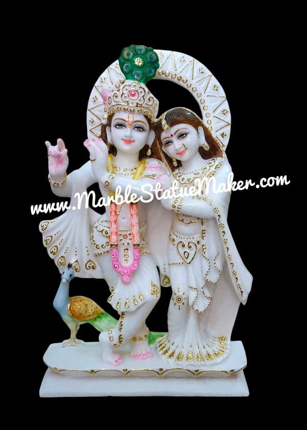 Bring divine love and spiritual elegance into your home with our beautifully handcrafted Marble Radha Krishna Murti. Made from premium quality marble by skilled artisans, this exquisite murti showcases the eternal bond of Radha and Krishna with fine detailing, graceful expressions, and traditional craftsmanship. Perfect for home temples, पूजा rooms, spiritual décor, and gifting purposes, this marble statue adds peace, positivity, and devotion to any space.Our Marble Radha Krishna Murti is available in various sizes, designs, and customized finishes to suit your needs. The smooth marble finish, intricate carvings, and vibrant hand-painted details make it a timeless masterpiece for devotees and art lovers alike.Marble Radha Krishna Murti, Radha Krishna Marble Statue, White Marble Radha Krishna Idol, Handmade Marble Moorti, Hindu God Marble Statue, Krishna Murti for Home Temple, Premium Marble Statue Manufacturer.