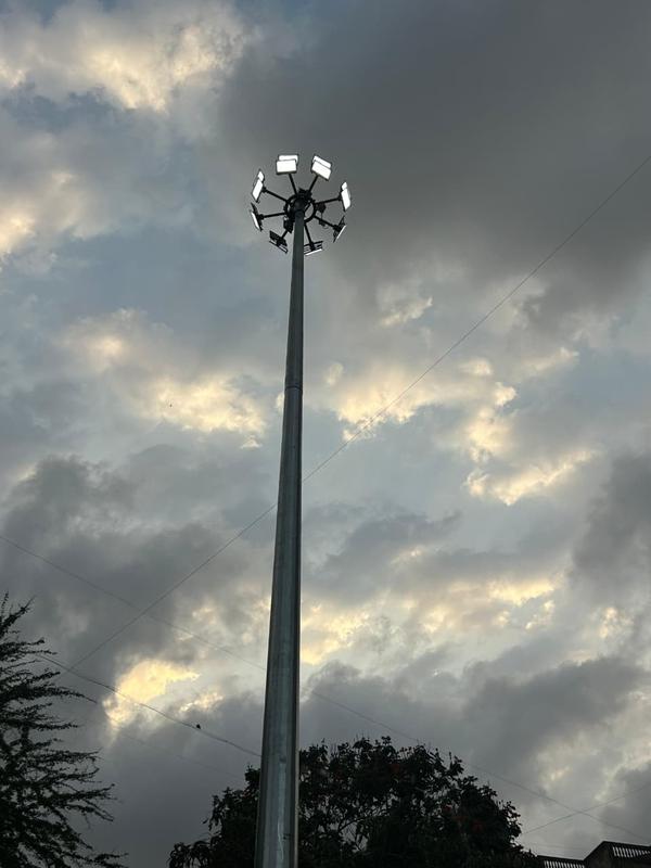 Highmast Pole is manufactured using heavy duty high tensile structural steel with multi-section polygonal construction for maximum strength, stability and long service life. The pole is available in heights ranging from 12 Meter to 45 Meter with customized top and bottom diameters as per lighting design and project requirements. Pole thickness is generally manufactured from 3 mm to 8 mm or higher depending upon load carrying capacity and wind pressure specifications.The structure is specially engineered to withstand high wind velocity, vibration and extreme weather conditions, making it ideal for highways, stadiums, airports, ports, industrial areas, large parking zones, railway yards and smart city infrastructure projects. The pole is designed with high load bearing capacity to support multiple flood lights and heavy lighting fixtures safely.The pole is hot dip galvanized with minimum 65 to 100 micron zinc coating for superior corrosion resistance and complete rust proof protection for long term outdoor performance. Optional PU Paint or weather resistant coating is provided for enhanced durability and premium finish. Highmast poles are supplied with motorized lowering and raising system, stainless steel wire rope, winch mechanism, lantern carriage and aviation lamp arrangement for easy maintenance and safe operation.The pole is installed with heavy duty base plate, foundation bolts and RCC foundation design for maximum structural stability and safety. Highmast & Stadium Pole provides excellent illumination coverage, low maintenance, high durability and reliable performance with international quality standards and premium engineering finish.