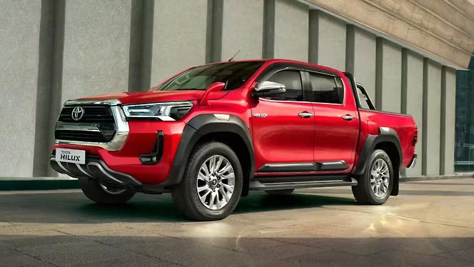 Toyota Hilux - Live a fuller lifeThe Toyota Hilux is a renowned, rugged 4 × 4 pickup truck. It comes equipped with a highly capable 2.8-liter diesel engine, standard 4WD, and a robust ladder-frame chassis. Known for its exceptional off-road prowess, it offers seating for five and a versatile open cargo bed.Key Specifications & PerformanceThe Hilux is engineered to handle demanding conditions without compromising on power.Engine: 2.8-liter, 4-cylinder Turbo DieselPower Output: 201.15 bhp (204 hp) @ 3000--3400 rpmTorque Output: 420 Nm (Manual) / 500 Nm (Automatic)Transmission: 6-speed Manual or 6-speed AutomaticFuel Capacity: 80 LitresOff-Road Capability: Features 700 mm of water-wading capacity and advanced 4WD (High/Low).DimensionsLength: 5325 mmWidth: 1855 mmWheelbase: 3085 mmGround Clearance: 216 mmInterior & FeaturesThe cabin blends tough utility with modern, SUV-like comfort and technology:Infotainment: 8.0-inch touchscreen display with Apple CarPlay and Android Auto compatibilitySafety: 7 SRS airbags, Anti-lock Braking System (ABS), front/rear parking sensors, and a tyre angle monitorConvenience: Dual-zone climate control, leather upholstery, and a multi-function steering wheel