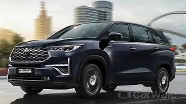 The Toyota Innova Hycross is a premium, monocoque MPV designed for comfort and efficiency, available in both petrol and strong hybrid variants. It delivers 173–184 bhp, achieves up to 23.24 kmpl in fuel efficiency, seats 7 or 8 passengers, and features a spacious cabin with high-end amenities.Quick Overview & PricePrices for the Toyota Innova Hycross in India start around ₹18.70 Lakh for the base petrol and go up to ₹37.25 Lakh (ex-showroom) for the fully-loaded hybrid models.Fuel Types: 2.0L Petrol (CVT) and 2.0L Petrol Strong Hybrid (e-CVT)Seating Capacity: 7 or 8 seatsFuel Economy: ~16.13 kmpl (Petrol) and up to 23.24 kmpl (Hybrid)Dimensions & ExteriorBuilt on the TNGA-C platform, the Hycross moves away from traditional ladder-frame MPVs, offering an SUV-like stance and enhanced driving dynamics.Length: 4,755 mmWidth: 1,850 mmHeight: 1,790 mmWheelbase: 2,850 mm (provides generous legroom)Wheel Options: Available in 16-inch, 17-inch, and 18-inch alloy wheel sizes depending on the variant.Engine & PerformancePetrol Variant: 1987 cc TNGA 4-cylinder engine, producing 173 bhp and 209 Nm of torque.Hybrid Variant: 1987 cc engine paired with a self-charging electric motor, producing 183.7 bhp and 188 Nm of torque.Key Features & ComfortDepending on the exact trim you choose (GX, VX, ZX, or ZX (O)), the Hycross offers premium, segment-first creature comforts:Ottoman Seats: Powered second-row captain seats with reclining and fold-out leg rests.Panoramic Sunroof: Features ambient mood lighting.Infotainment: Up to a 25.65 cm (10.1-inch) touchscreen system with Apple CarPlay and Android Auto, paired with a premium JBL audio system.Tech & Convenience: Ventilated front seats, powered tailgate, and a 360-degree camera system.
