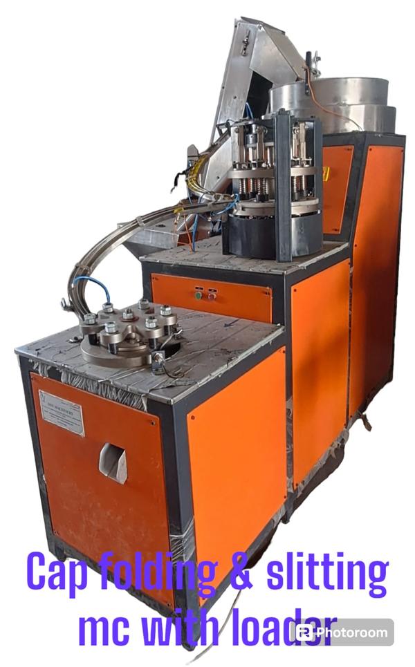 Capacity : 200 caps/minUsage/Application : Plastic cap manufacturingHeight Of Conveyor : 7.5 feet(1100x560x2200)Weight L : 550 kgsAutomation Grade : AutomaticVoltage : 415 v ac wth neutralCap Size : Customise i.e 28 mm ,38 mmMachine Dimensions : 2100x700x1900Number Of Heads : 6 headStar Wheel Assly : 6 headElectrical Supply : 415 v ac 50 hz,with neutralAir Pressure : 6barMinimum order quantity : 01We are engaged in offering a wide range of  Cap Slitting Folding Machine Loader  to our clients. Our range of all products is widely appreciated by our clients.
