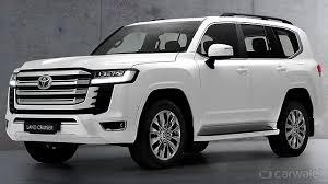 Toyota Land Cruiser 300The Toyota Land Cruiser 300 (LC300) is the flagship, full-size luxury SUV from Toyota. It replaces the legendary LC200 by retaining a tough body-on-frame platform while utilizing advanced technology, a lighter chassis, and an extremely powerful twin-turbo powertrain for unmatched durability and prestige.Key Specifications & FeaturesEngine Options:3.3-Liter Twin-Turbo Diesel V6 (produces 304 PS to 308 HP and 700 Nm of torque)3.5-Liter Twin-Turbo Gasoline V6 (415 PS and 650 Nm of torque)Transmission: 10-speed automaticDrivetrain: Full-time AWDDimensions:Length: 4,965 mm – 4,985 mmWidth: 1,980 mm – 1,990 mmWheelbase: 2,850 mm (same as the LC200)Off-Road Capabilities: Features a 235 mm ground clearance, Multi-Terrain Select (MTS), Crawl Control, and a Turn Assist function for tight corners.Design & EngineeringWeight Reduction: The torsional stiffness is increased by 20% over the previous generation, and the increased use of aluminum (doors, bonnet, tailgate) shaves off around 200 kg from the total weight.Cabin & Comfort: Known for its traditional, button-heavy dashboard (preventing reliance solely on touchscreens), it is offered in 5-seater or 7-seater configurations depending on the regional market. It features a 12.3-inch infotainment display, a large center console cool box, and 4-zone climate control.Safety: Highly rated with 10 airbags and advanced Toyota Safety Sense systems (Pre-Collision, Lane Tracing Assist, Dynamic Radar Cruise Control).Variants & Pricing in IndiaIn the Indian market, the Land Cruiser 300 is priced in the range of ₹2.18 Cr to ₹2.25 Cr (ex-showroom) and is available in two primary variants:ZX: The luxury-focused trim.GR-S: The sports/off-road focused trim.