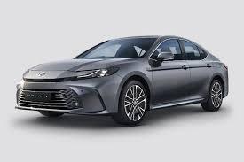 The Toyota Camry is a premium mid-size hybrid sedan renowned for its exceptional reliability, plush cabin comfort, and outstanding fuel efficiency. Powered by a 2.5L strong-hybrid engine, it delivers a punchy combined output (227 bhp / 230 PS) alongside class-leading fuel economy. Prices start at ₹47.48 Lakh (ex-showroom) in India.Key SpecificationsFeatureDetailsEngine2487 cc, 4-Cylinder Petrol with Hybrid Synergy DriveTransmissione-CVT Automatic (FWD)Power & Torque227 bhp / 230 PS & 221 NmFuel Economy25.49 km/l (ARAI-certified)Boot Space524 – 587 LitresFuel Tank Capacity50 LitresDesign & DimensionsLength: 4,920 mmWidth: 1,840 mmWheelbase: 2,825 mmExterior Highlights: Hammerhead-inspired front fascia, LED lighting, and 18-inch alloy wheels.Comfort & TechnologySeating: 5-seater with ventilated 10-way power-adjustable front seats and driver memory settings.Infotainment: 31.24 cm (12.3-inch) digital driver's display and 12.3-inch central touchscreen with wireless Apple CarPlay and Android Auto.Chauffeur-Friendly: Rear seats feature a powered recline function, along with central armrest controls for audio, climate, and sunshades.Other Features: Three-zone climate control, wireless charging, nanoe™ X air purification, and a panoramic sunroof.SafetyAirbags: 9 SRS airbagsDriver Assistance: Level-2 Toyota Safety Sense (ADAS) including Adaptive Cruise Control, Lane Departure Alert, Pre-Collision System, and 360-degree camera.Additional: Vehicle Stability Control, TPMS, and electronic parking brake with auto-hold.