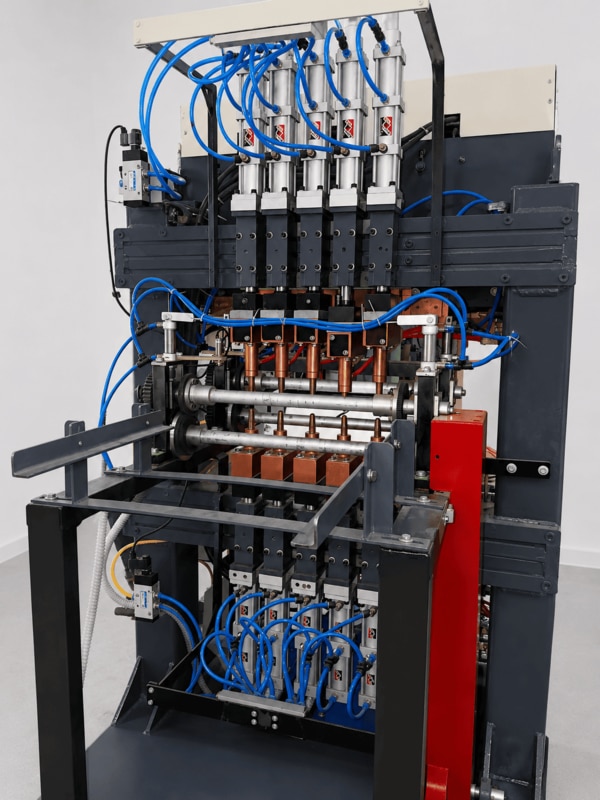 Product OverviewThe Pneumatic Multi-Spot Welding Machine is designed for high-speed, repeatable, and accurate welding of sheet metal assemblies, wire products, brackets, frames, mesh components, battery parts, and fabricated assemblies requiring multiple weld points in a single cycle.Technical SpecificationsMachine Type: Pneumatic Multi-Spot Resistance Welding MachineWelding Method: Resistance Spot WeldingNumber of Welding Heads:  5 spots/6 spots (As per customer requirement)Electrode Actuation:	Pneumatic CylindersElectrode Material:	Copper AlloyElectrode Force:	AdjustableInput Power Supply:	415V AC, 3 Phase, 50HzTransformer Rating:	CustomizedDuty Cycle:	50%Cooling System:	Water-CooledControl System:	Universal Weld ControllerProduction Mode:	Semi-Automatic / AutomaticMachine Construction:	Heavy-Duty Fabricated Steel StructureMachine Dimensions (L x W x H):	1700 mm x 1200 mm x 1500 mm (approx.)Key FeaturesSimultaneous Multi-Point WeldingPneumatic Electrode ActuationHeavy-Duty Copper Alloy ElectrodesAdjustable Welding PressureConsistent Weld QualityRobust Industrial ConstructionEasy Setup and MaintenancePLC / HMI-Based Control (Optional)Water-Cooled Transformer and ElectrodesSuitable for Continuous ProductionAdvantagesHigher ProductivityReduced Cycle TimeUniform Weld QualityLower Operator DependencyReduced Rejection RateLong Service LifeLow Maintenance CostCustomization AvailableMachine design, throat depth, welding head arrangement, transformer capacity, fixture design, automation level, and control system can be customized according to customer requirements.