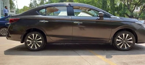 Honda City ZX MT (Pre-Owned) – Garve Honda Auto Terrace, ChinchwadPremium Sedan | Low Mileage | Exceptional ValueOwn the iconic Honda City ZX MT, a premium pre-owned sedan that combines elegant styling, refined performance, advanced features, and Honda's legendary reliability. With its sophisticated Golden Brown Metallic finish and low mileage, this well-maintained sedan is an excellent choice for buyers looking for comfort, performance, and value.Vehicle Details:Model: Honda City ZX MTManufacturing: February 2023Colour: Golden Brown MetallicOdometer: 11,364 kmTransmission: 6-Speed ManualFuel Type: PetrolPrice: ₹12,00,000/-Key Highlights:✅ Premium ZX Variant✅ Elegant Golden Brown Metallic Colour✅ Only 11,364 km Driven✅ Powerful 1.5L i-VTEC Petrol Engine✅ Smooth 6-Speed Manual Transmission✅ Electric Sunroof✅ LED Headlamps with LED DRLs✅ Premium Leather Upholstery✅ Wireless Apple CarPlay & Android Auto✅ Automatic Climate Control✅ Honda LaneWatch™ Camera✅ 5-Star Safety with 6 Airbags, ABS & Vehicle Stability Assist (VSA)Why Choose This Honda City ZX MT?The Honda City ZX MT delivers a refined driving experience with its responsive 1.5L i-VTEC petrol engine, premium cabin, and advanced safety technologies. Whether you're commuting in the city or heading out on long drives, it offers outstanding comfort, fuel efficiency, and driving pleasure.Why Buy from Garve Honda Auto Terrace, Chinchwad?✔ Honda Certified Pre-Owned Vehicle✔ Thorough Quality Inspection✔ Transparent Vehicle History✔ Attractive Finance & EMI Options✔ Exchange Assistance Available✔ Hassle-Free Documentation✔ Trusted Honda Dealership✔ Excellent After-Sales SupportBuy a certified pre-owned Honda City ZX MT (February 2023) in Golden Brown Metallic from Garve Honda Auto Terrace, Chinchwad. Only 11,364 km driven. Priced at ₹12,00,000. Book your enquiry today!Used Honda City ZX MT Chinchwad, Honda City ZX Manual Pune, Honda City Golden Brown Metallic, Pre-Owned Honda City Pune, Honda City Second Hand Chinchwad, Honda City 2023 Model Pune, Honda City Low Mileage Pune, Honda City ZX Petrol Manual, Certified Used Honda City Pune, Honda City for Sale PCMC, Honda City Auto Terrace Chinchwad, Used Honda Cars Chinchwad, Honda City Manual Petrol Pune, Best Used Honda City Pune, Garve Honda Auto Terrace Used Cars, Honda City ZX MT Price Pune, Honda City Pre-Owned Car Chinchwad, Honda Certified Used Cars Pune.