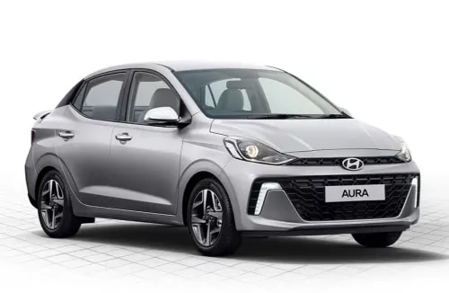 The Hyundai AURA is a stylish, spacious, and feature-rich compact sedan that offers an ideal combination of modern design, advanced technology, outstanding fuel efficiency, and class-leading safety. Available at Ketan Hyundai, Amravati, the Hyundai AURA is designed to meet the needs of urban families, professionals, and first-time car buyers looking for a premium driving experience at an affordable price.With its elegant styling, comfortable interiors, smart connectivity, refined performance, and Hyundai's trusted reliability, the Hyundai AURA stands out as one of the most value-packed sedans in its segment.The Hyundai AURA features a modern and sophisticated exterior design that reflects Hyundai's contemporary styling philosophy. The bold chrome front grille, LED Daytime Running Lamps (DRLs), projector headlamps, stylish bumper design, diamond-cut alloy wheels, LED tail lamps, shark-fin antenna, and aerodynamic body lines give the sedan a premium and confident road presence.Its compact dimensions make city driving and parking effortless, while its elegant design ensures it looks stylish from every angle.Step inside the Hyundai AURA and experience a spacious cabin designed for comfort and convenience. The premium dual-tone interior, ergonomically designed seats, generous legroom, ample headroom, and large boot space make every journey comfortable for both driver and passengers.The Hyundai AURA is equipped with several premium convenience features, including:8-inch Touchscreen Infotainment SystemWireless Apple CarPlay & Android AutoDigital Instrument Cluster with Multi-Information DisplayAutomatic Climate ControlRear AC VentsWireless Smartphone ChargerCruise ControlPush Button Start with Smart KeyElectrically Adjustable ORVMsRear Parking CameraSteering Mounted Audio & Bluetooth ControlsUSB Charging PortsPremium Fabric Seat UpholsteryThe cabin is thoughtfully designed to provide a connected, enjoyable, and relaxing driving experience.The Hyundai AURA is powered by Hyundai's refined and fuel-efficient 1.2L Kappa Petrol Engine, delivering smooth performance, excellent refinement, and low maintenance costs. Customers can also choose the Hyundai AURA Hy-CNG Duo variant, which features dual-cylinder CNG technology for improved boot space, exceptional mileage, and economical running costs.Transmission options include:5-Speed Manual TransmissionAutomated Manual Transmission (AMT)Whether you're navigating city traffic or cruising on highways, the Hyundai AURA offers responsive performance, impressive fuel efficiency, and a smooth driving experience.Safety is one of Hyundai's highest priorities, and the Hyundai AURA is equipped with advanced safety technologies to ensure peace of mind for every journey.