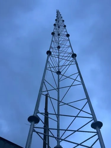 30 Meter CCTV Camera Tower – Manufacturing, Supply & Installation in Dombivli for Rustomjee BuildersWe are proud to have successfully completed the manufacturing, supply, and installation of a 30-meter Hot-Dip Galvanized CCTV Camera Tower for Rustomjee Builders in Dombivli. Designed and engineered for superior strength, durability, and long-term performance, this tower provides an ideal solution for wide-area surveillance and security monitoring.Manufactured using high-grade structural steel and finished with premium hot-dip galvanization, the tower offers exceptional corrosion resistance, high wind-load capacity, and minimal maintenance, ensuring reliable performance even in challenging weather conditions. Every project is executed with strict quality control, precision engineering, and professional installation to meet the highest industry standards.At AS INFRA Engineers & Contractors, we specialize in the design, manufacturing, supply, and installation of CCTV Camera Towers, High Mast Poles, Lighting Towers, and Custom Steel Structures across India. Our commitment to quality, safety, and timely project execution makes us a trusted partner for infrastructure and surveillance solutions.