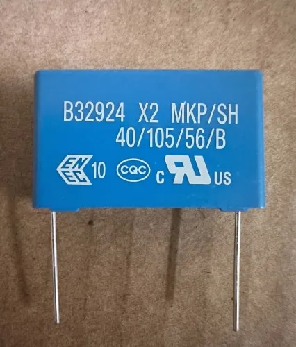 The B32924C3105M is an X2-class safety film capacitor manufactured by TDK (formerly EPCOS). Designed for EMI (Electromagnetic Interference) suppression, it prevents electrical noise from traveling between power lines or devices, ensuring safe, stable operation in standard AC voltage applications.Capacitance: 1 μ F (microfarad). A microfarad is a measurement of electrical charge storage, typically used for filtering and stabilizing power.Voltage Rating: 305V AC and 630V DC. This makes it suitable for standard AC mains power circuits.Tolerance: ± 20%. This means the actual capacitance can vary up to 20% above or below the stated 1 μ F.Dielectric Material: Metallized Polypropylene (PP). Polypropylene is excellent at handling high-frequency signals and provides a “self-healing” property—if a small internal short-circuit occurs, it will vaporize the metal around it to prevent the entire component from failing.Lead Spacing: 27.5 mm. This is the distance between the two pin terminals, determining how it mounts onto a circuit board.Operating Range: Handles temperatures between -40°C and +110°C.Safety Rating: X2. This means it is designed for “across-the-line” applications where failure of the capacitor would not lead to an electric shock.
