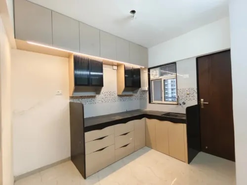 Modern Modular Kitchen.Transform your cooking space with our premium L-Shaped Modular Kitchen, designed to combine style, functionality, and smart storage. This modern kitchen features spacious cabinets, multiple drawers, overhead storage units, and a durable countertop, providing an organized and clutter-free cooking experience. The elegant color combination and contemporary design enhance the beauty of your home while maximizing available space.Manufactured by Shree Ganesh CNC and Woodtech, this kitchen is crafted using high-quality materials, precision CNC technology, and premium hardware fittings to ensure durability and long-lasting performance. The thoughtfully designed layout offers easy access to kitchen essentials, making daily cooking more convenient and efficient.Key Features:✔ Modern L-shaped modular kitchen design✔ Spacious overhead and base cabinets✔ Multiple storage drawers for better organization✔ Premium soft-close hardware and fittings✔ Durable and easy-to-maintain countertop✔ Smart storage solutions for maximum space utilization✔ Elegant finish with contemporary aesthetics✔ Customizable sizes, colors, and layouts available✔ Professional manufacturing and installation.
