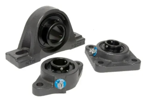 NTN ULTRA-CLASS™ Mounted Bearing Units – Suresh Bearing CompanyNTN ULTRA-CLASS™ Mounted Bearing Units Supplier in IndiaSuresh Bearing Company is a trusted supplier of NTN ULTRA-CLASS™ Mounted Bearing Units, providing high-performance bearing solutions designed for demanding industrial environments. As one of NTN’s premium mounted bearing series, ULTRA-CLASS™ units are engineered to deliver exceptional reliability, durability, and operational efficiency in applications exposed to dust, moisture, vibration, contamination, and heavy shock loads.Available in both metric and inch sizes, NTN ULTRA-CLASS™ Mounted Bearing Units are factory assembled, sealed, and pre-lubricated to ensure quick installation, reduced maintenance requirements, and long service life.Heavy-Duty ConstructionNTN ULTRA-CLASS™ Mounted Bearing Units are manufactured with solid-cast iron housings and high-strength steel cages, providing excellent mechanical strength and stability for heavy-duty applications.FeaturesHeavy-duty solid cast housing designHigh-strength steel cage constructionExcellent shock-load resistanceSuperior structural rigidityReliable performance in harsh environmentsExtended bearing service lifeHigh load-carrying capabilityInnovative Ball-Point Set Screw TechnologyThe ULTRA-CLASS™ series incorporates NTN’s advanced ball-point set screw design, featuring a 120° screw orientation that provides improved shaft alignment and stronger locking performance compared to conventional 90° set screw designs.This innovative semi-retractable ball-point mechanism delivers excellent tightening torque characteristics while reducing shaft damage.BenefitsImproved shaft centering and alignmentUp to 7.5 times longer set screw retention lifeHigh tightening torque performancePrevents damage to shaft surfacesSecure and vibration-resistant mountingEnhanced operational reliabilityAdvanced Triple Protection Sealing SystemNTN ULTRA-CLASS™ Mounted Bearing Units feature a combination of high-performance elastomeric seals and NTN outer flinger technology. This unique sealing arrangement creates a protective barrier that prevents dust, dirt, moisture, and contaminants from reaching the bearing raceways.AdvantagesSuperior contamination protectionReduced wear and corrosionExtended bearing lifeImproved sealing performanceReduced maintenance requirementsReliable operation in dusty and moisture-prone environmentsNTN ULTRA-CLASS™ Product RangeSuresh Bearing Company supplies a complete range of NTN ULTRA-CLASS™ Mounted Bearing Units, including:Pillow Block Bearing UnitsTwo-Bolt Flange Bearing UnitsFour-Bolt Flange Bearing UnitsMetric Series Mounted UnitsInch Series Mounted UnitsMaintenance-Free Bearing UnitsFood-Grade Grease Bearing UnitsSolid Lubricant Bearing UnitsKey Features of NTN ULTRA-CLASS™ BearingsGenuine NTN ULTRA-CLASS™ Mounted Bearing UnitsFactory assembled and pre-lubricated designEasy installation and maintenance-friendly operationHeavy-duty cast housing constructionAdvanced contamination sealing systemSuperior shaft locking mechanismHigh load capacityLow vibration and quiet operationLong operational lifeReliable performance in challenging conditionsApplications of NTN ULTRA-CLASS™ Mounted Bearing UnitsNTN ULTRA-CLASS™ Mounted Bearing Units are widely used in:Material Handling EquipmentConveyor SystemsMining EquipmentCement PlantsAgricultural MachineryFood Processing EquipmentPackaging MachineryTextile IndustrySteel PlantsPaper MillsChemical Processing EquipmentIndustrial Fans & BlowersConstruction EquipmentHeavy MachineryWhy Choose Suresh Bearing Company?Supplier of genuine NTN ULTRA-CLASS™ BearingsWide availability of standard and special sizesCompetitive pricingTechnical support for bearing selectionFast delivery across IndiaTrusted industrial bearing supplierReliable after-sales supportQuality-focused bearing solutionsIndustries We ServeOur NTN ULTRA-CLASS™ bearing solutions are used in:Manufacturing IndustryMining IndustryCement IndustrySteel IndustryAgriculture IndustryFood & Beverage IndustryPackaging IndustryTextile IndustryChemical IndustryPower Generation IndustryConstruction IndustryMaterial Handling Industry