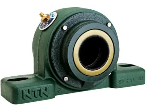 NTN Heavy-Duty Mounted Bearing Units – Suresh Bearing CompanyNTN Heavy-Duty Mounted Unit Series Supplier in IndiaSuresh Bearing Company is a trusted supplier of NTN Heavy-Duty Mounted Bearing Units, offering reliable bearing solutions designed for extreme operating environments such as mining, construction, material handling, heavy machinery, and industrial processing applications.NTN Heavy-Duty Mounted Units combine robust housing designs with precision-engineered self-aligning spherical roller bearings to provide excellent load-carrying capacity, operational stability, and extended service life. These bearing units are designed for applications where durability, contamination protection, easy maintenance, and dependable performance are essential.NTN SAF & SNC Heavy-Duty Mounted Bearing SeriesThe NTN SAF Series (Inch Dimensions) and SNC Series (Metric Dimensions) are heavy-duty two-piece bearing housing solutions designed for easy installation, inspection, and maintenance.These units are equipped with precision-manufactured self-aligning spherical roller bearings, allowing smooth operation even under heavy loads, shaft deflection, and alignment variations.Key FeaturesHeavy-duty two-piece housing designAvailable in inch and metric sizesCompatible with self-aligning spherical roller bearingsEasy installation and maintenanceHigh load-carrying capacityExcellent running performanceExtended bearing service lifeModular and flexible designSuitable for heavy industrial applicationsAdvanced Sealing SolutionsNTN provides multiple sealing options for heavy-duty mounted bearing units where protection against contamination is critical.These advanced sealing systems protect bearings from dust, dirt, moisture, and other harsh environmental contaminants, improving reliability and reducing maintenance requirements.BenefitsSuperior contamination resistanceReduced wear and corrosionLonger maintenance intervalsImproved bearing reliabilityEnhanced protection in harsh environmentsIncreased operating lifeNTN SPAW / SPW / SFCW Spherical Roller Bearing UnitsFor applications exposed to severe contamination and demanding operating conditions, NTN offers SPAW, SPW, and SFCW Series Spherical Roller Bearing Units.These units provide an easy-to-install alternative to traditional SAF units while delivering excellent corrosion protection and heavy-duty performance.The single-piece housing design ensures high mechanical strength, excellent shock stability, and reliable operation in challenging industrial environments.FeaturesSolid one-piece housing constructionHigh mechanical strengthExcellent shock-load stabilitySpring-loaded contact sealsPhosphate-coated bearing insertsSuperior corrosion resistanceExcellent contamination protectionQuick and simple installationReliable performance in harsh conditionsApplications of NTN Heavy-Duty Mounted Bearing UnitsNTN Heavy-Duty Mounted Bearing Units are widely used in:Mining EquipmentConstruction MachineryQuarry EquipmentCrushersConveyor SystemsSteel PlantsCement IndustriesBulk Material Handling SystemsHeavy Manufacturing EquipmentAgricultural MachineryPower PlantsIndustrial Processing EquipmentMaterial Handling ApplicationsWhy Choose Suresh Bearing Company?Supplier of genuine NTN Heavy-Duty Mounted Bearing UnitsComplete SAF, SNC, SPAW, SPW & SFCW series solutionsHigh-quality industrial bearing productsExpert bearing selection assistanceCompetitive pricingReliable supply across IndiaTechnical support for heavy-duty applicationsTrusted industrial bearing partnerExcellent customer service and supportIndustries ServedSuresh Bearing Company supplies NTN bearing solutions for:Mining & Minerals IndustryConstruction IndustrySteel & Metal ProcessingCement IndustryPower GenerationManufacturing IndustryAgriculture IndustryMaterial Handling IndustryHeavy EngineeringIndustrial AutomationProcess Industries