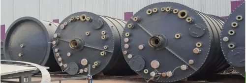 FRP (Fiber Reinforced Plastic) Agitator Vessels are corrosion-resistant process vessels equipped with a mechanical agitator or mixer to blend, dissolve, suspend, or homogenize liquids and chemicals. Manufactured using high-strength fiberglass reinforcement and premium thermosetting resins such as Vinyl Ester, Isophthalic Polyester, or Epoxy, these vessels are designed to withstand highly corrosive environments while ensuring efficient mixing and process consistency.FRP agitator vessels are widely used in chemical processing, pharmaceuticals, water treatment, food processing, and other industries where corrosion resistance and reliable mixing performance are essential.An FRP agitator vessel combines storage and mixing functions in a single unit. A motor-driven agitator rotates specially designed impellers inside the vessel, creating controlled fluid movement to ensure uniform mixing.The vessel typically consists of:FRP Vessel BodyMechanical AgitatorElectric Gear MotorMixing ShaftImpeller or TurbineTop CoverInlet and Outlet NozzlesManholeVent ConnectionDrain ValveSupport Legs or SkirtThe agitator speed, impeller type, and motor capacity are selected according to the viscosity, density, and mixing requirements of the process fluid.