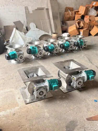 SS Rotary Air Lock Valve – Product DescriptionSS Rotary Air Lock Valve is a precision-engineered material handling equipment designed for the controlled discharge, feeding, and metering of powders, granules, pellets, flakes, and other dry bulk materials while maintaining an effective air seal between different pressure zones.Manufactured from Stainless Steel SS304 or SS316, the valve offers excellent corrosion resistance, durability, and hygienic operation. It is particularly suitable for applications where cleanliness and resistance to moisture or corrosive materials are important.The precision-fitted rotary rotor enables smooth and continuous material discharge with reduced air leakage, making it suitable for pneumatic conveying, dust collection, hopper and silo discharge, cyclone systems, and bag filter applications.Key FeaturesSS304 / SS316 stainless steel constructionCorrosion-resistant and durable designEfficient air-lock sealingSmooth and continuous material dischargeSuitable for powder and granular materialsLow-maintenance operationAvailable with direct, chain, or gear-motor driveCustomizable rotor and valve configurationsSuitable for hygienic and demanding industrial applicationsApplicationsSS Rotary Air Lock Valves are widely used in pharmaceutical, food processing, chemical, fertilizer, plastics, minerals, cement, powder processing, pneumatic conveying, dust collection, silos, hoppers, cyclones, and bag filter systems.
