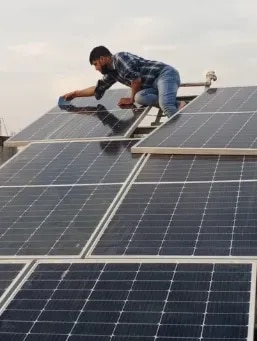 Solar Power Panel System in Delhi – Aditya Infra SolutionsAditya Infra Solutions provides reliable Solar Power Panel System Solutions in Delhi for residential, commercial, and industrial applications. Based in Mangolpuri Industrial Area Phase II, we offer solar panel systems designed to convert sunlight into usable electricity and help customers adopt clean, renewable energy.A solar PV system generally consists of solar panels, an inverter, mounting structures, electrical protection equipment, cables, and metering components. In a grid-connected system, the inverter converts the DC electricity generated by the panels into AC electricity and synchronizes it with the grid.Solar Power Panel System InstallationAditya Infra Solutions provides project assistance and installation services for solar power panel systems according to the customer's energy requirements, available space, and site conditions.Our solar solutions include:Solar Power Panel SystemRooftop Solar Panel SystemOn-Grid Solar Panel SystemOff-Grid Solar Power SystemHybrid Solar Power SystemCommercial Solar Panel SystemIndustrial Solar Power SystemSolar Power Plant InstallationSolar Energy Storage SystemSolar Panel MaintenanceSolar Panel Cleaning and WashingHow a Solar Power Panel System WorksSolar photovoltaic panels capture sunlight and convert it into DC electrical energy. The inverter then converts this electricity into AC power suitable for electrical loads. In grid-connected systems, the inverter can synchronize the generated power with the utility grid.A typical solar power panel system may include:Solar PV PanelsSolar panels are the primary energy-generating component. Multiple photovoltaic modules can be connected to form an array according to the required system capacity.Solar InverterThe inverter converts DC electricity from the solar panels into AC electricity for use by electrical appliances and equipment.Mounting StructureStrong mounting structures hold the solar panels securely in the required orientation and position.Electrical Protection EquipmentCables, junction boxes, circuit breakers, fuses, earthing, and lightning protection can form part of the balance-of-system components.Energy MeteringGrid-connected systems can use suitable metering arrangements to monitor electricity consumption and solar electricity supplied to or received from the grid.On-Grid Solar Power Panel SystemOur On-Grid Solar Power Panel Systems in Delhi are suitable for properties with an existing electricity-grid connection. Solar electricity generated during daylight hours can be utilized by the property according to the system configuration.Where applicable, grid connection and net-metering arrangements are subject to prevailing regulations, utility requirements, and approvals. MNRE's rooftop solar programme provides the framework for grid-connected rooftop solar installations.Off-Grid Solar Power Panel SystemFor locations requiring greater energy independence, we provide Off-Grid Solar Power Panel Systems. These systems can be integrated with battery storage to store solar-generated electricity for use when sunlight is unavailable.Off-grid systems can be considered for properties and applications where grid electricity is unavailable, unreliable, or where independent solar power is required.Hybrid Solar Power Panel SystemA Hybrid Solar Power Panel System combines solar generation with battery storage and, depending on the system design, grid or other backup power sources. This configuration can provide greater flexibility in managing solar energy and backup requirements.Hybrid systems can be considered for homes, offices, commercial properties, factories, warehouses, and other applications where energy storage is desirable.Commercial & Industrial Solar Panel SystemsAditya Infra Solutions provides solar panel systems for:FactoriesManufacturing UnitsWarehousesOfficesCommercial BuildingsShops and ShowroomsHotelsInstitutionsHospitalsIndustrial FacilitiesFor commercial and industrial projects, the system can be planned according to electricity consumption, available rooftop area, electrical infrastructure, and project objectives.Solar Panel System for RooftopsRooftop solar can make productive use of suitable roof space for electricity generation. According to the National Rooftop Solar Portal FAQ, a 1 kWp rooftop solar system generally requires around 10 square metres of shadow-free area, although actual requirements can vary depending on module efficiency and placement.Our team can assist with evaluating the available installation area and planning an appropriate solar panel configuration.Benefits of a Solar Power Panel SystemClean Energy GenerationSolar panels generate electricity from sunlight, providing a renewable source of energy.Reduced Dependence on Conventional PowerGenerating electricity on-site can help reduce dependence on conventional electricity, depending on system capacity and consumption.Productive Rooftop UtilizationSuitable rooftops can be utilized for solar electricity generation without requiring additional ground space.Flexible System OptionsCustomers can choose from on-grid, off-grid, and hybrid configurations according to their energy and backup requirements.Long-Term Renewable Energy SolutionA professionally planned solar power panel system can form part of a property's long-term energy-management strategy.India's installed solar capacity reached 164.59 GW as of July 31, 2026, including 30.74 GW of grid-connected rooftop solar, demonstrating the growing adoption of solar power across the country.Solar Panel Maintenance ServicesAditya Infra Solutions also provides Solar Panel Maintenance and Washing Services to help keep installed panels clean and operating effectively. Regular inspection and cleaning can help address accumulated dust and dirt on panels.Our maintenance support can include:Solar Panel CleaningSolar Plant WashingSolar System InspectionSolar Panel MaintenanceGeneral Solar Installation SupportWhy Choose Aditya Infra Solutions?Project Assistance: We assist customers with planning and implementing solar power projects.Multiple System Options: We provide on-grid, off-grid, hybrid, rooftop, commercial, and industrial solar solutions.Customized Planning: Solar systems can be planned according to energy consumption, available space, and site conditions.Installation Support: Our team provides installation assistance for solar panels and associated equipment.Maintenance Services: We also offer solar panel cleaning and maintenance support.Quality-Focused Solutions: For projects where MNRE's ALMM requirements apply, eligible solar PV modules must meet the applicable approved-model and manufacturer requirements.Solar Power Panel System in Mangolpuri, DelhiAditya Infra Solutions is located at Phase 2, Pocket B, E/49, Mangolpuri Industrial Area Phase II, New Delhi, Delhi – 110083. We provide solar power panel systems and renewable-energy solutions for customers in Mangolpuri and across Delhi NCR.If you are looking for a Solar Power Panel System in Delhi for your home, office, factory, warehouse, commercial building, or industrial facility, Aditya Infra Solutions can assist with system planning, installation, energy storage, and maintenance.Aditya Infra Solutions – Reliable Solar Power Panel Systems for Clean, Efficient and Sustainable Energy in Delhi NCR.