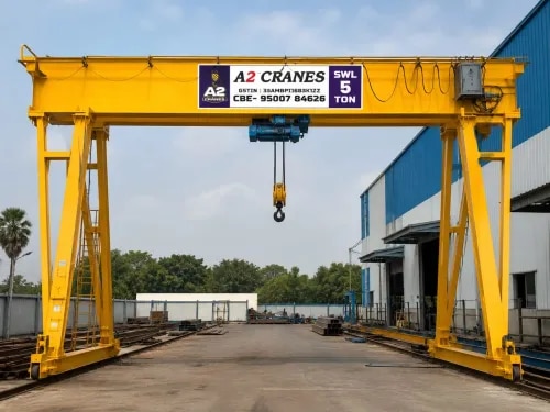 Gantry Crane Manufacturer in CoimbatoreGantry CraneA2 Cranes is a trusted Gantry Crane Manufacturer in Coimbatore, offering robust and efficient lifting solutions for industrial material handling. Gantry Cranes are designed with a bridge structure supported by legs that travel along rails or a suitable running surface, making them suitable for lifting and moving heavy materials across designated work areas.Our Gantry Cranes can be customized according to lifting capacity, span, lifting height, travel distance, operating environment, and specific application requirements.Reliable Gantry Crane SolutionsA2 Cranes designs and manufactures Gantry Cranes with a focus on structural strength, stability, safety, smooth operation, and reliable performance. These cranes are suitable for both indoor and outdoor material-handling applications.Gantry Crane systems can be configured for different industrial requirements, including heavy machinery handling, steel movement, fabrication, construction, and warehouse operations.Key Features of Gantry Crane• Heavy-duty structural construction• Strong and stable supporting legs• Efficient electric lifting system• Smooth crane and trolley movement• Customized lifting capacity• Customized span and lifting height• Suitable for indoor and outdoor applications• Reliable load handling• Easy operation and maintenance• Application-specific crane design• Suitable for heavy industrial applicationsApplications of Gantry CranesGantry Cranes are widely used across various industries and material-handling environments, including:• Manufacturing Industries• Engineering Industries• Steel Industries• Fabrication Units• Automobile Industries• Construction Sites• Warehouses• Shipyards• Foundries• Power Plants• Machinery Manufacturing• Industrial Workshops• Heavy Equipment HandlingAdvantages of Gantry CraneHeavy Load HandlingGantry Cranes are designed to efficiently lift and move heavy materials and equipment within defined working areas.Indoor & Outdoor ApplicationsTheir independent supporting structure makes Gantry Cranes suitable for various indoor and outdoor industrial applications.Efficient Workspace UtilizationThe crane's travelling structure enables effective movement of loads across the available working area.Customized DesignA2 Cranes develops Gantry Crane systems based on lifting capacity, span, lifting height, travel requirements, and site conditions.Improved ProductivityEfficient overhead material handling can reduce manual handling requirements and help improve industrial workflow.Reliable PerformanceRobust structural design and suitable crane components help provide dependable performance in demanding working environments.Why Choose A2 Cranes?A2 Cranes combines engineering expertise, precision fabrication, quality components, customized design, and customer-focused service to provide reliable Gantry Crane solutions.Our cranes are developed to meet the practical material-handling requirements of different industries while focusing on safety, performance, and durability.Based in Coimbatore, Tamil Nadu, A2 Cranes serves industrial customers looking for dependable Gantry Crane and material-handling solutions.Technical SpecificationsGantry Crane specifications can be customized according to the customer's application:• Lifting Capacity: As per requirement• Crane Span: Customized• Lifting Height: As per application• Crane Travel: As required• Hoist Type: Electric / Application-specific• Trolley Movement: Motorized / Application-specific• Control System: Pendant / Remote / Customized• Power Supply: As per application• Structure: Heavy-duty fabricated structure• Installation: Based on site requirementsGet a Customized Gantry CraneLooking for a reliable Gantry Crane Manufacturer in Coimbatore?A2 Cranes provides customized Gantry Crane solutions designed for safe, efficient, and reliable lifting and material handling across industrial environments.A2 Cranes – Strong Engineering. Reliable Lifting. Efficient Material Handling.