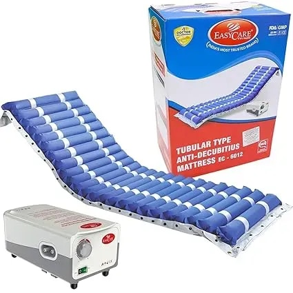 Cleaned up — *EASYCARE Tubular Type Anti-Decubitus Mattress EC-6012*Blue air mattress + pump + original box. Box says India's Most Trusted Brand, FDA/GMP, 5 Year Warranty.Pure white, sharp, ready for listing / IndiaMART / your surgical shop catalogue.Want me to also make a version with mattress on a hospital bed?