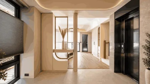 Modern Beige Entrance Foyer with Curved Console and Luxury Marble Clad Elevator | Porur product image